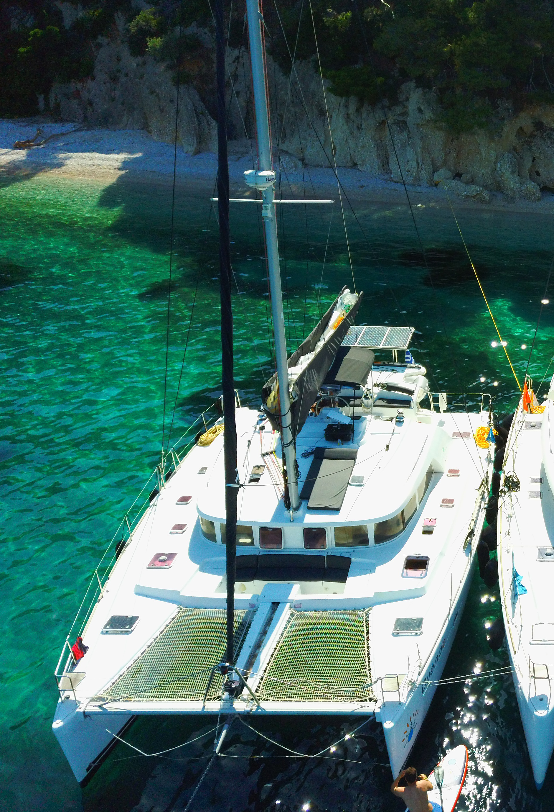 Sailing boat with group enjoying open sea and coastline views